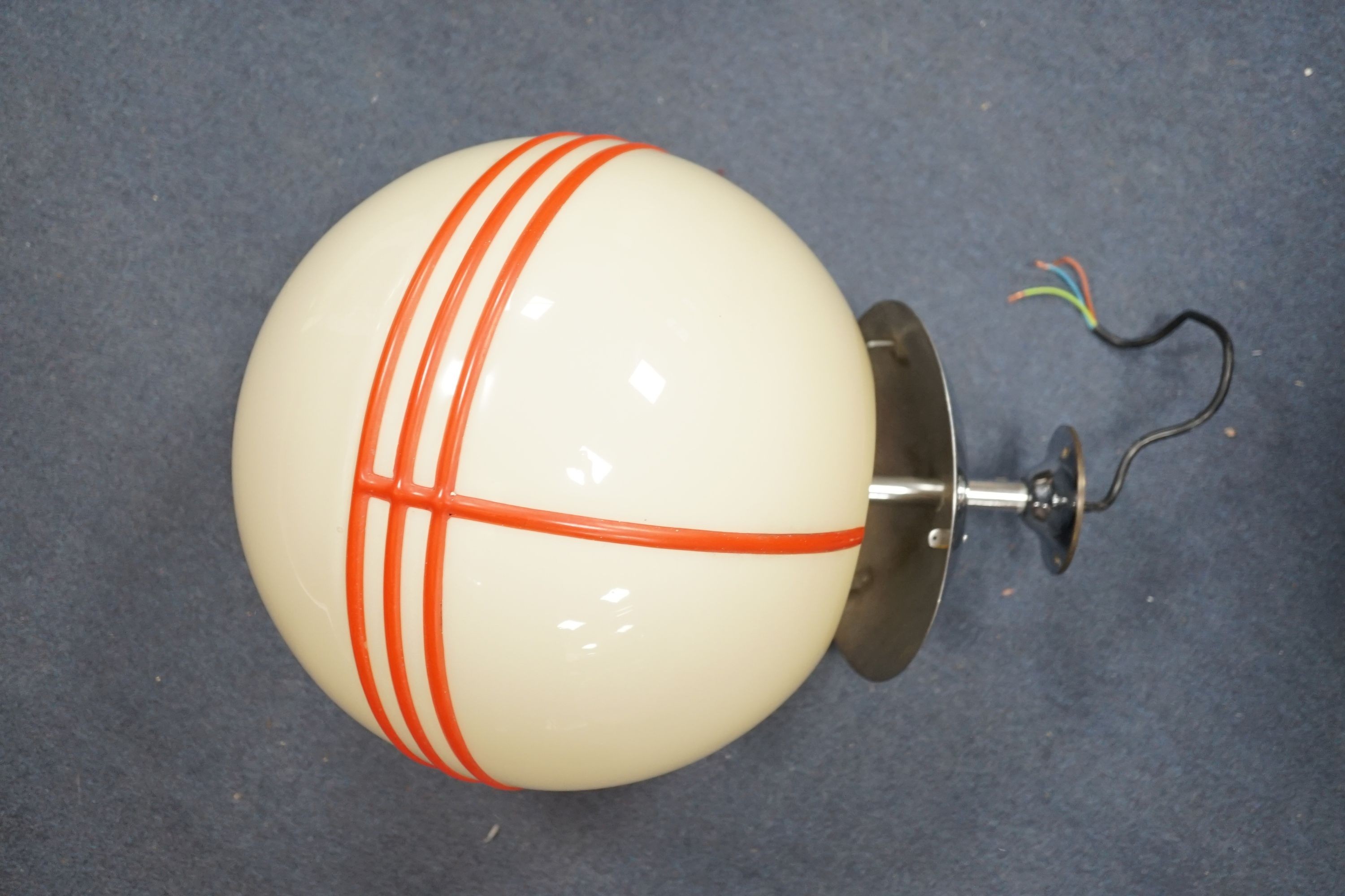 An Art Deco style chrome and cream globular shaded ceiling light with orange trailed decoration, probably 1930s